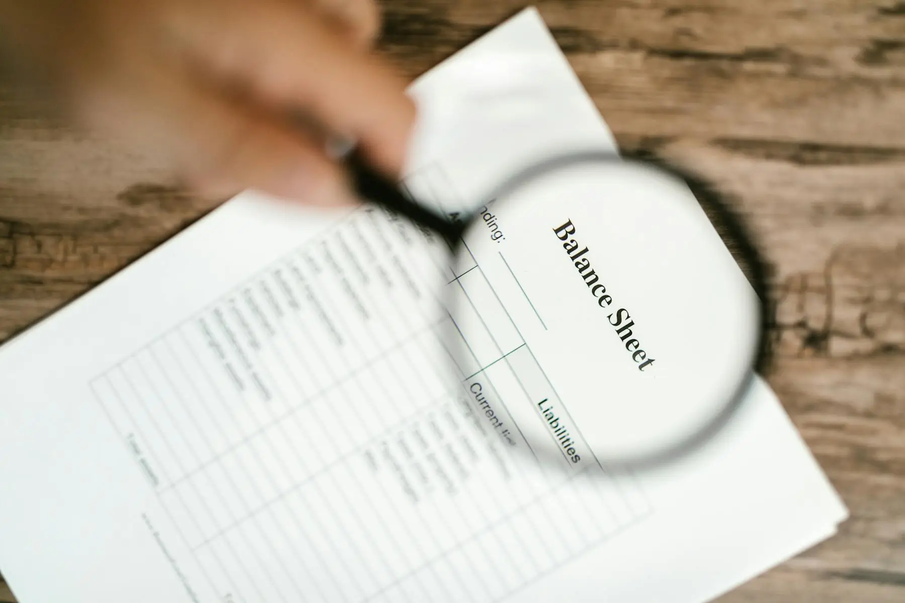Close-up of a professional managing secure document versions on a laptop